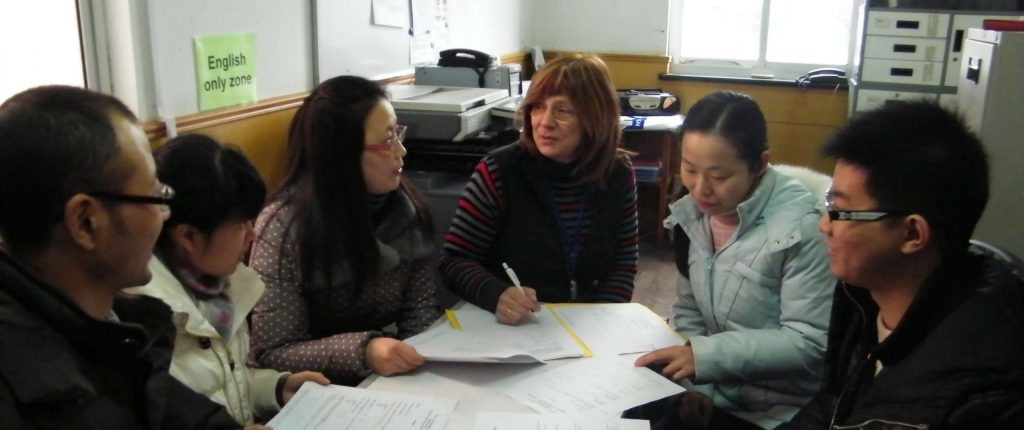 group of English teachers having a meeting with DOS