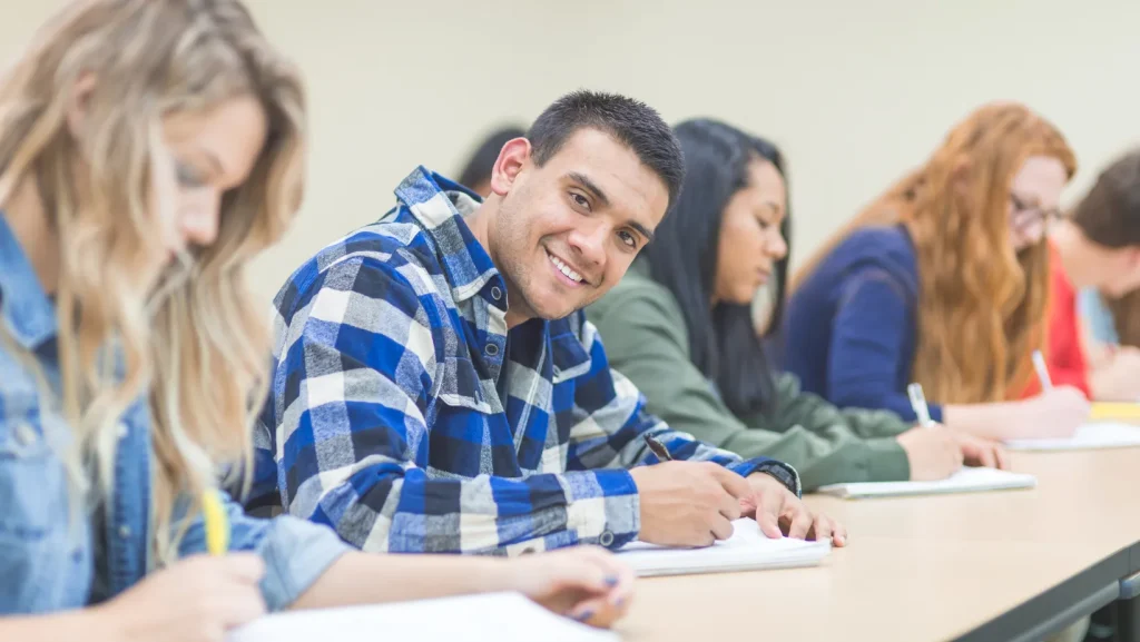 A group of students sitting in a classroom.